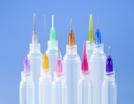 Different Optimum dispense tips on clear syringe barrels