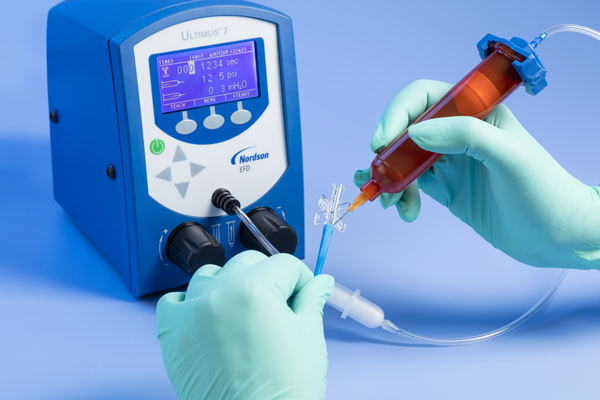 Ultimus I High Precision Dispenser Dispensing UV-Cure Adhesive onto a Medical Device
